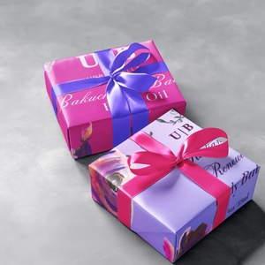 Urbanbella Spring Mystery Boxes – Deluxe and Spring Luxe Trio wrapped in vibrant floral packaging with satin ribbon bows.